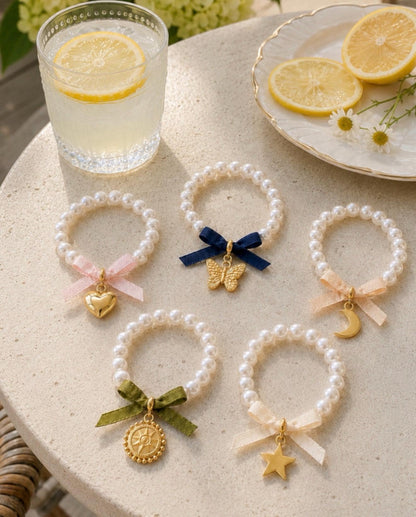 Pearl Charm Bracelet, Gold Tone, Bow Accent, Heart, Butterfly, Moon, Sun, Star Charms